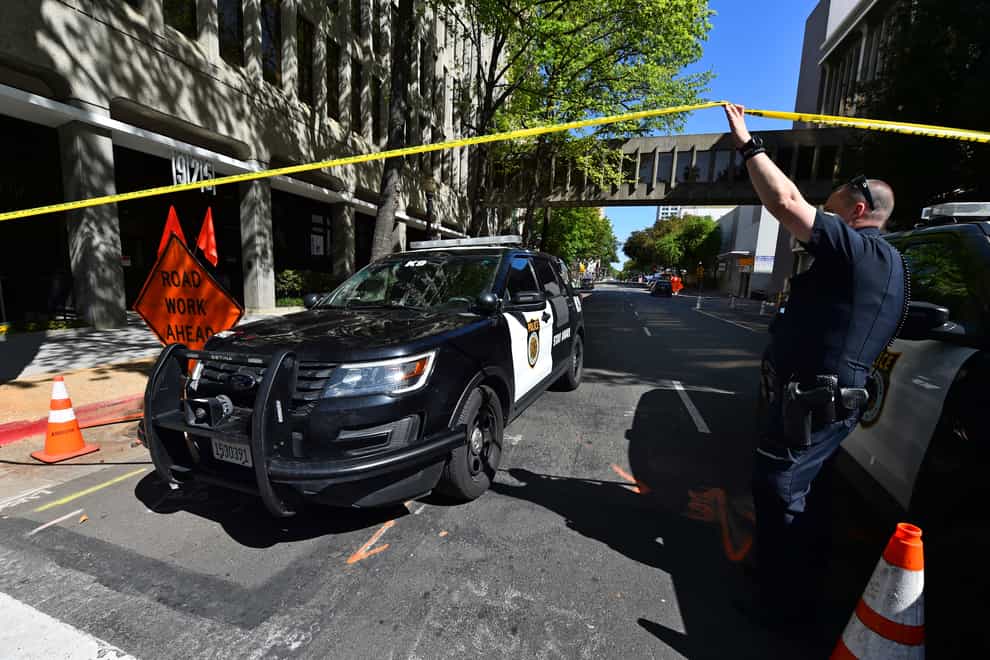 A police car leaves the scene of a mass shooting in Sacramento, California, on Sunday (Jose Carlos Fajardo/Bay Area News Group/AP)
