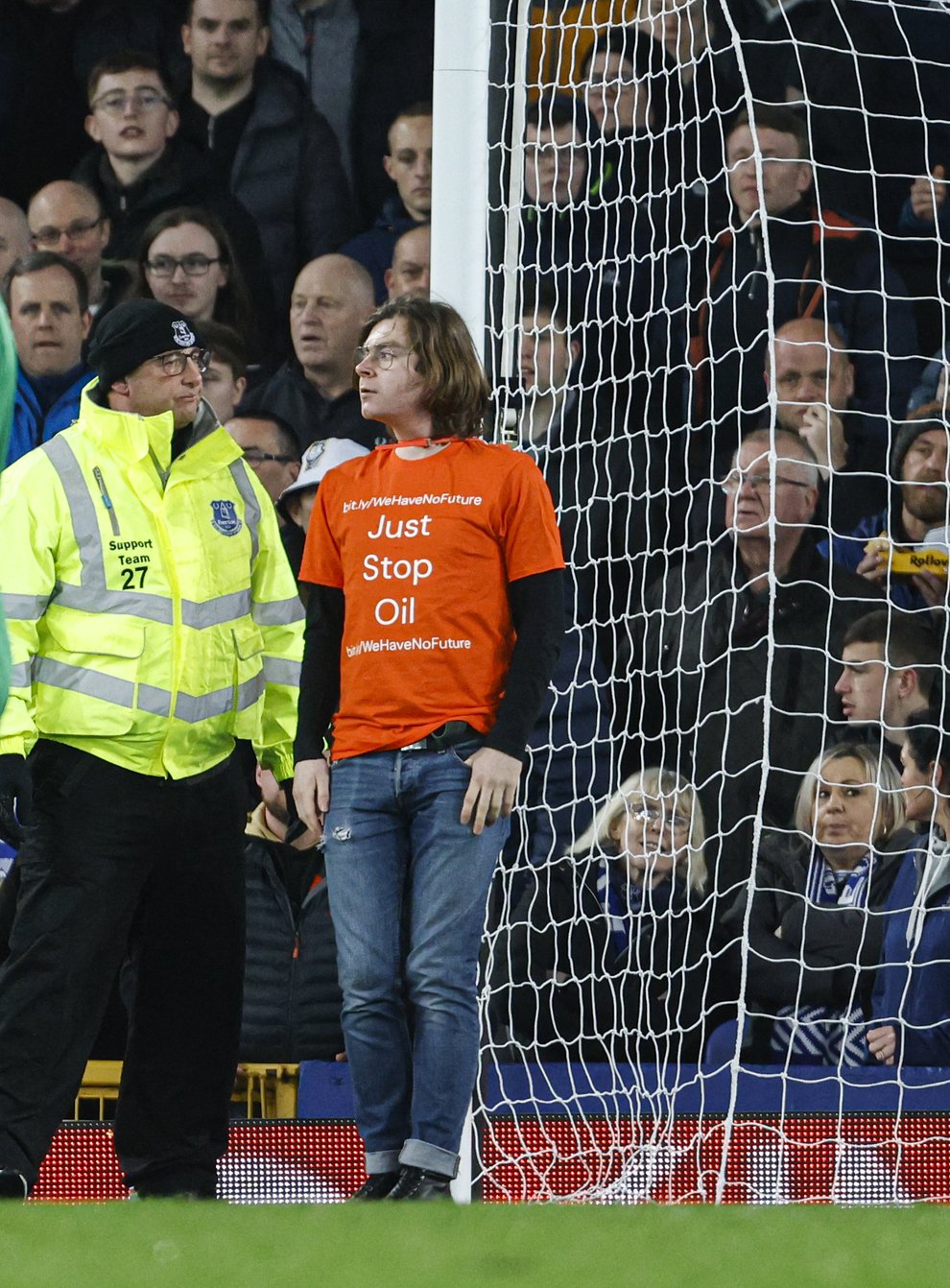 Protester Louis McKechnie tied himself to a goalpost during the Premier League match between Everton and Newcastle Utd at Goodison Park (Richard Sellers/PA)