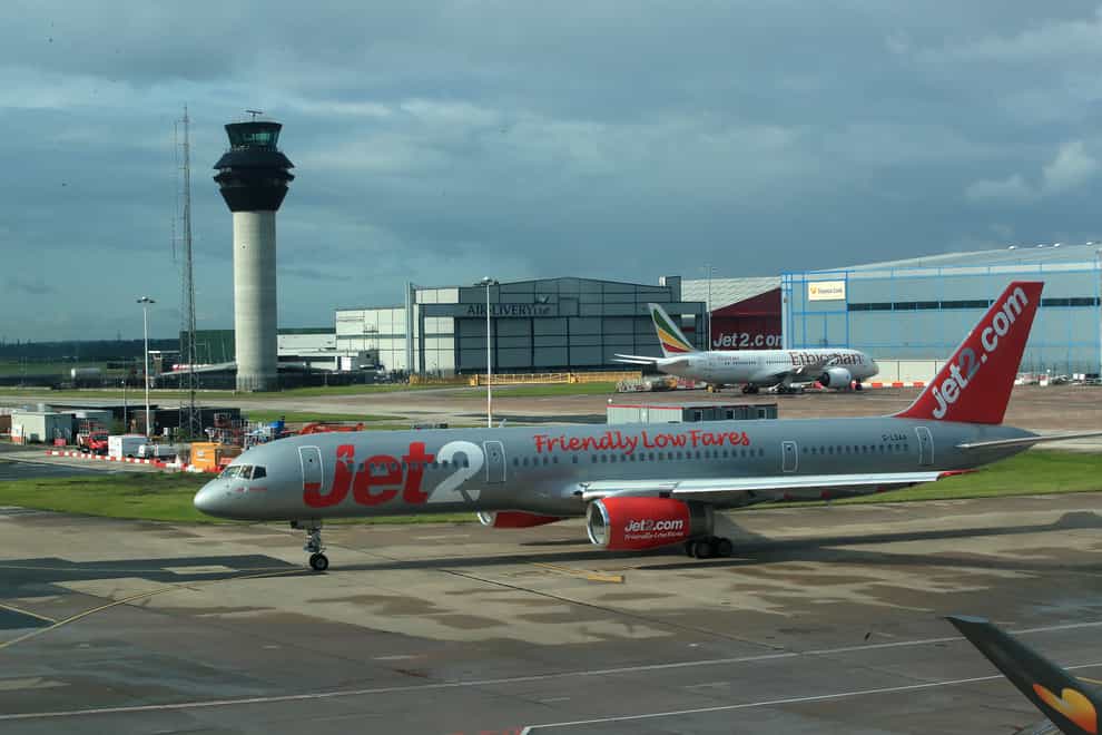 Je2 and Ethiopian planes on the runway at terminal one Manchester Airport (Peter Byrne/PA)