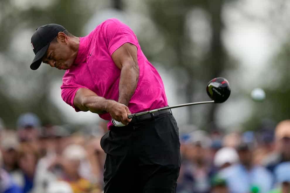 Tiger Woods tees off on the first hole in the opening round of the Masters (Matt Slocum/AP)