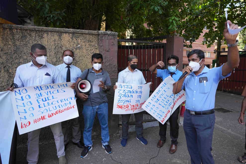 Sri Lankan government medical officers protest outside the national hospital in Colombo, Sri Lanka (Eranga Jayawardena/AP)
