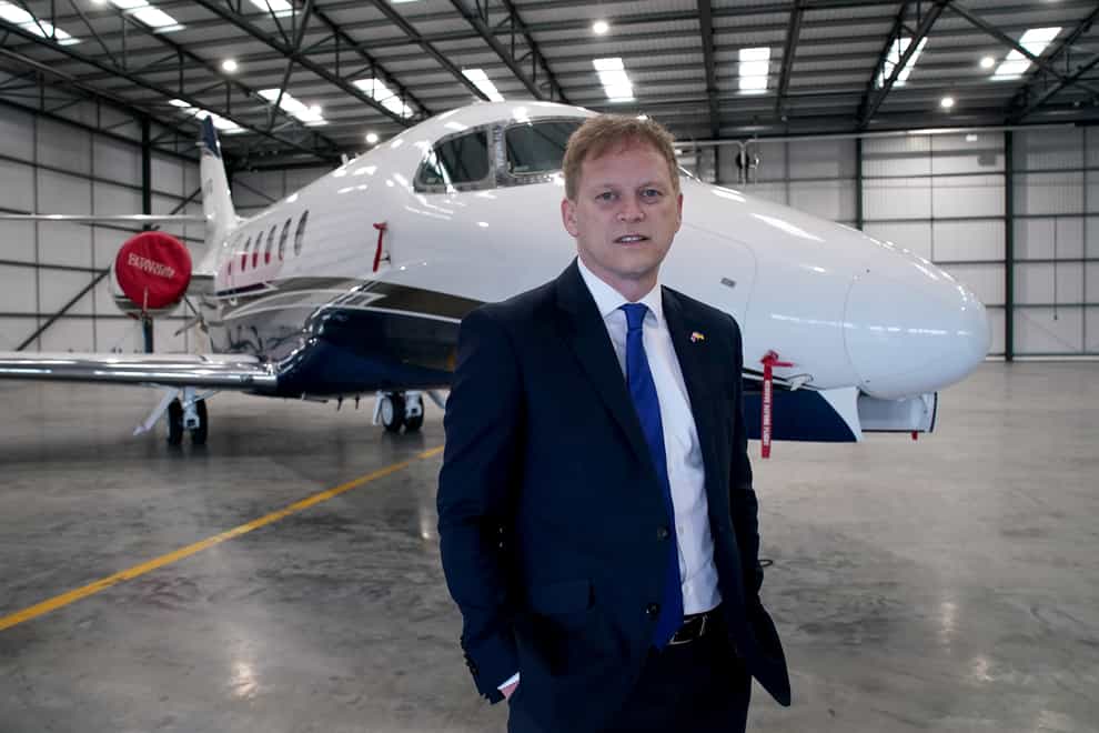 Transport Secretary Grant Shapps standing in front of a grounded private jet (Gareth Fuller/PA)
