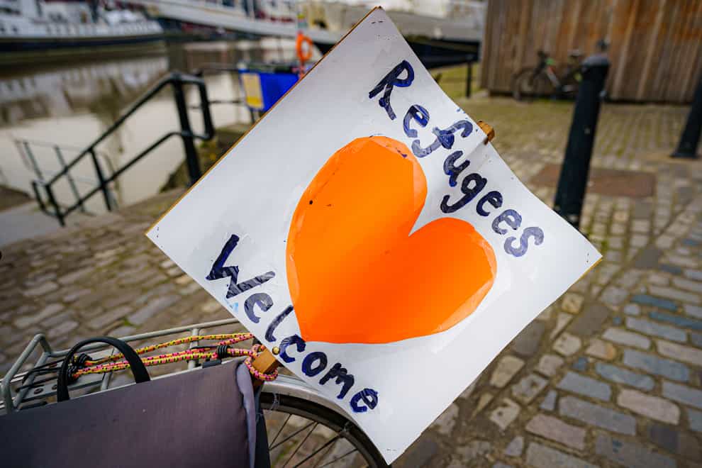 A ‘refugees welcome’ banner attached to a bicycle by a small flotilla of boats leaving Bristol harbour in support of Ukrainian refugees (Ben Birchall/PA)