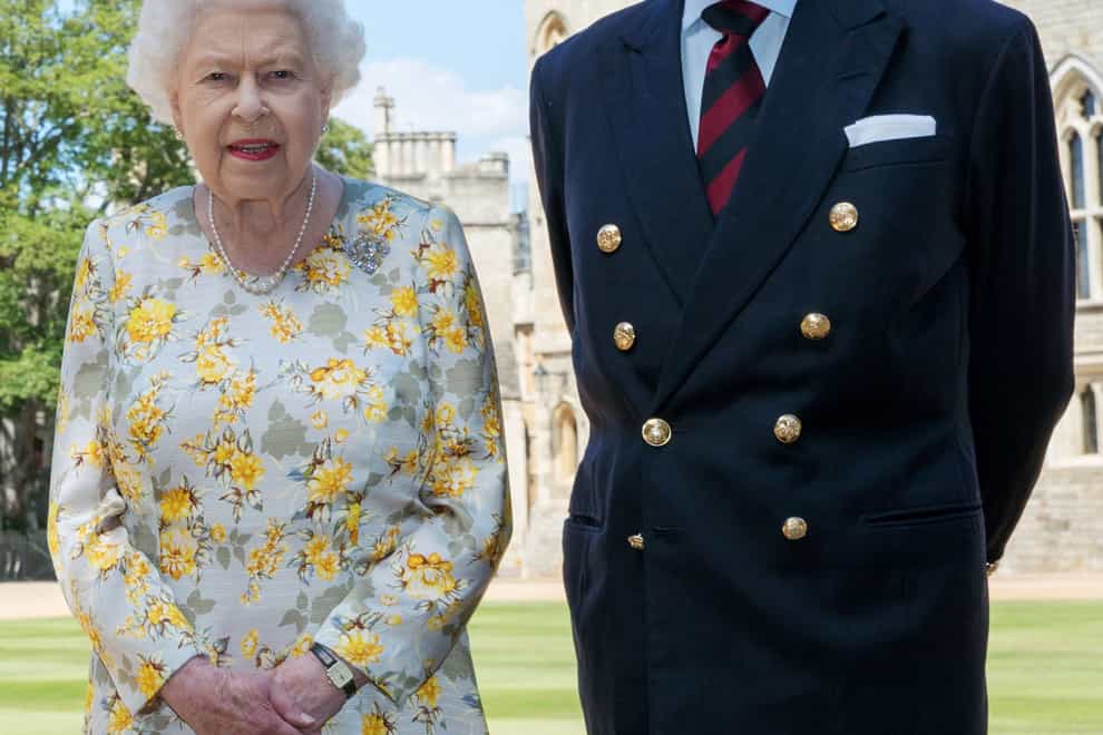 The Queen and the Duke of Edinburgh pictured at Windsor Castle in 2020 (Steve Parsons/PA)