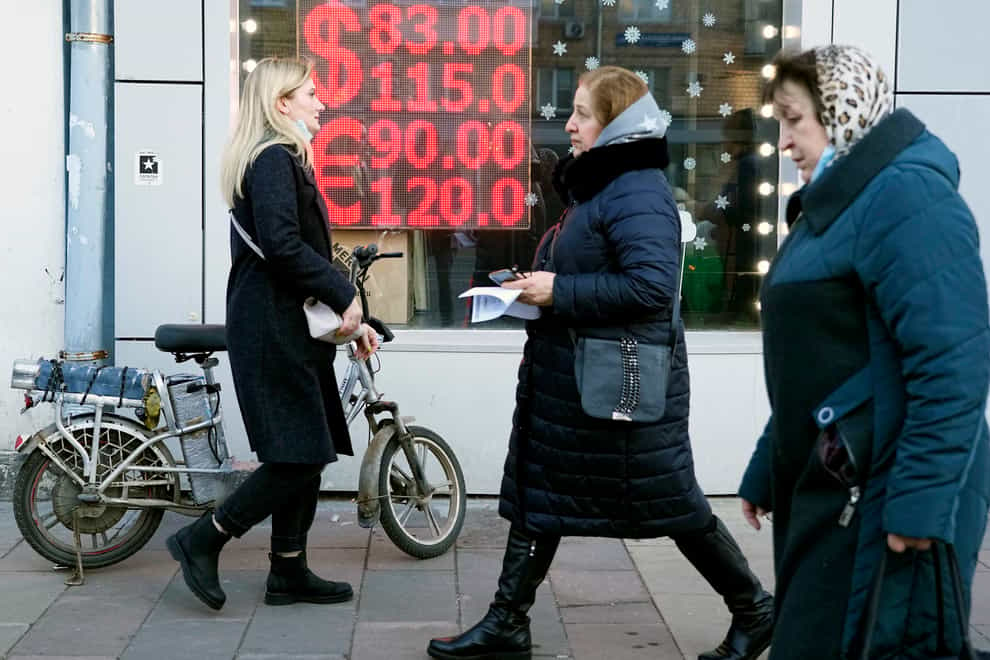 A currency exchange screen displays exchange rates in Moscow in February (Pavel Golovkin/AP)