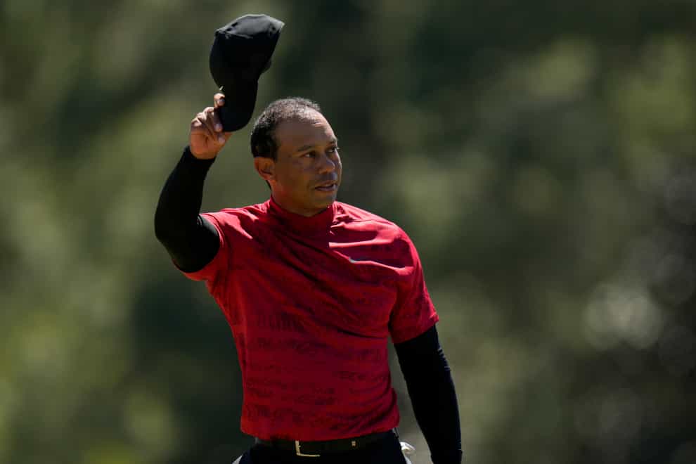 Tiger Woods tips his cap on the 18th green after his final round of the Masters (Jae C. Hong/AP)