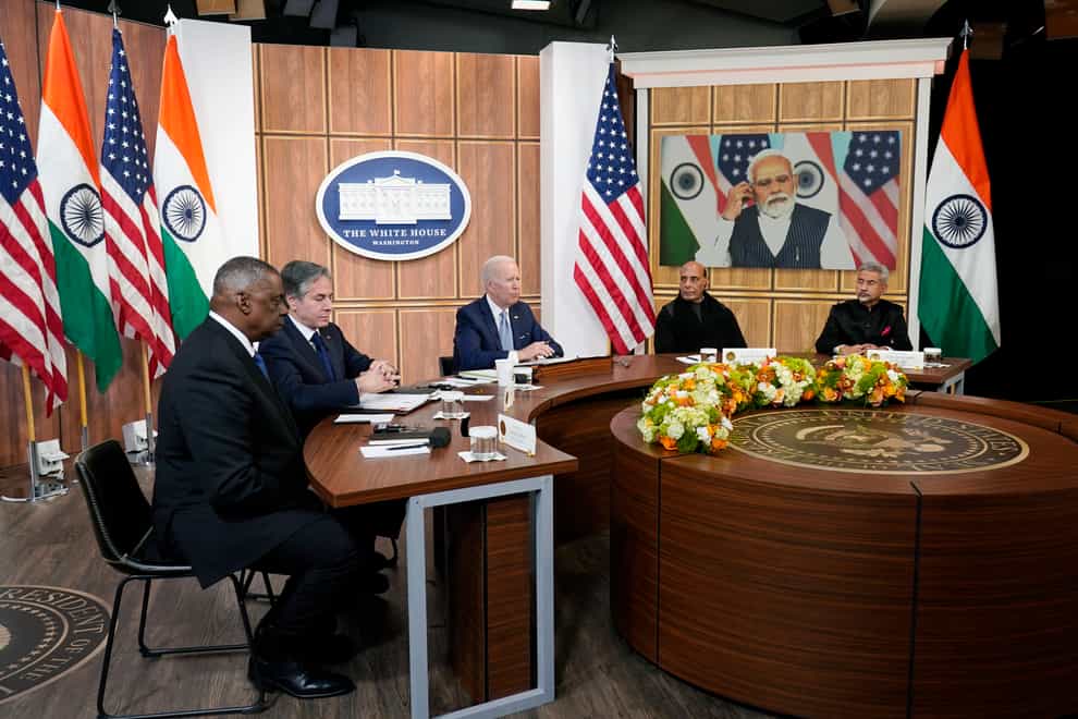 President Joe Biden meets virtually with Indian Prime Minister Narendra Modi in the South Court Auditorium on the White House campus in Washington, Monday, April 11, 2022. Secretary of Defence Lloyd Austin, left, and Secretary of State Antony Blinken, second left, and Indian Minister of Defense Rajnath Singh, second right, Minister of External Affairs Subrahmanyam Jaishankar is right. (Carolyn Kaster/AP)