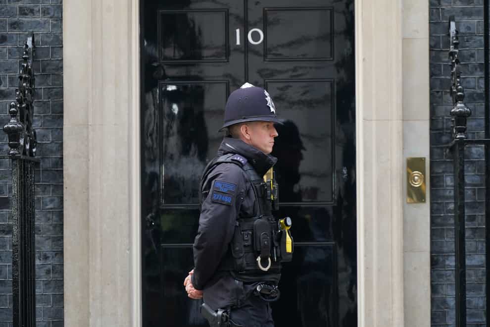 A police officer outside 10 Downing Street, in Westminster, London (Yui Mok/PA)