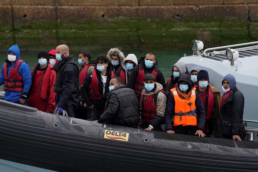 A group of people thought to be migrants are brought in to Dover, Kent, onboard a Border Force vessel following a small boat incident in the Channel. Picture date: Wednesday April 13, 2022. (Gareth Fuller/PA)