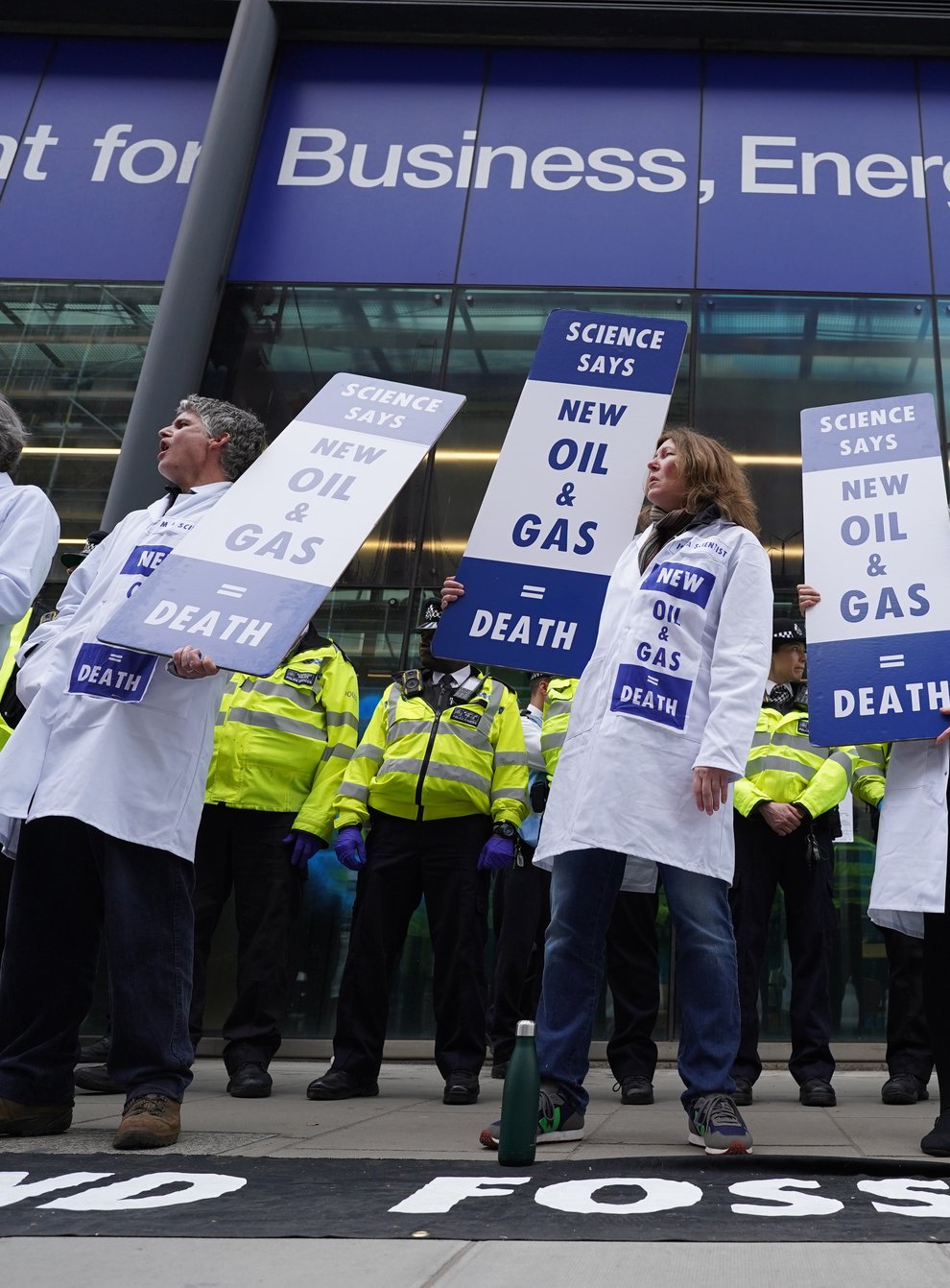 Demonstrators outside the Department for Business in London (Stefan Rousseau/PA)