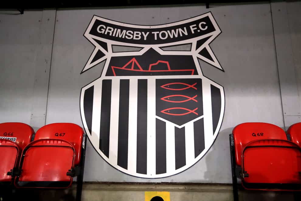 Grimsby came from a goal down to beat the 10 men of Stockport (Mike Egerton/PA)