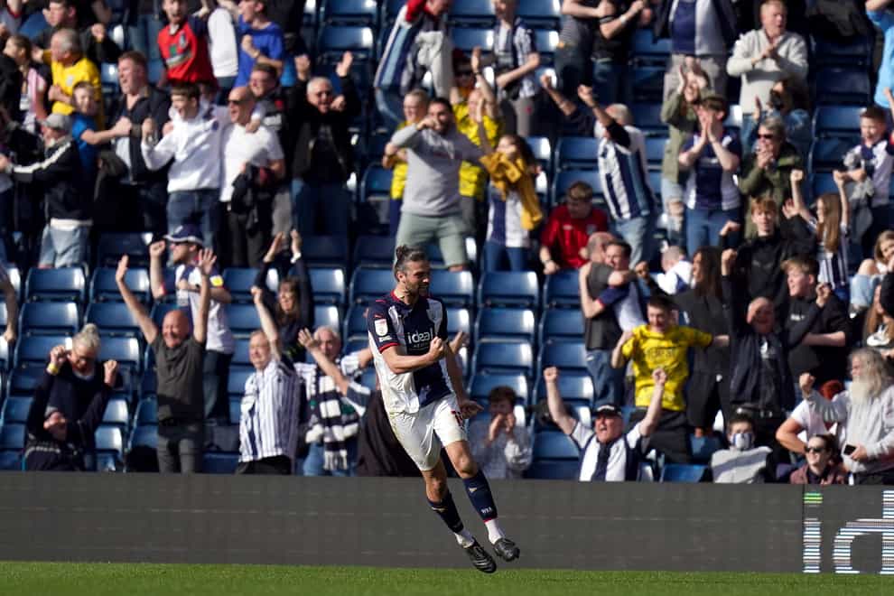 Andy Carroll celebrates Karlan Grant’s late winner in front of the West Brom fans (Jacob King/PA)