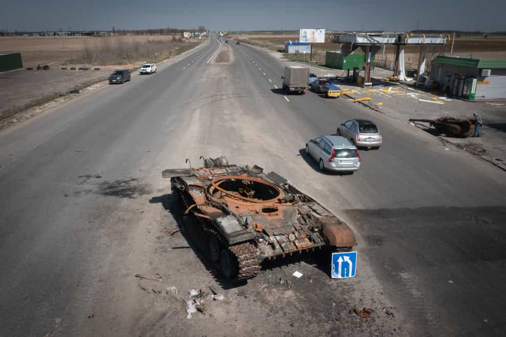 A Russian tank destroyed in recent fighting is seen on a road to Kyiv, Ukraine (Efrem Lukatsky/AP)