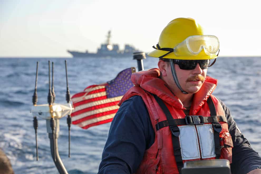A sailor, assigned to the USS Cole, takes part in an exercise in the Red Sea (Mass Communication Specialist Seaman Christopher Stachyra/US Navy via AP)