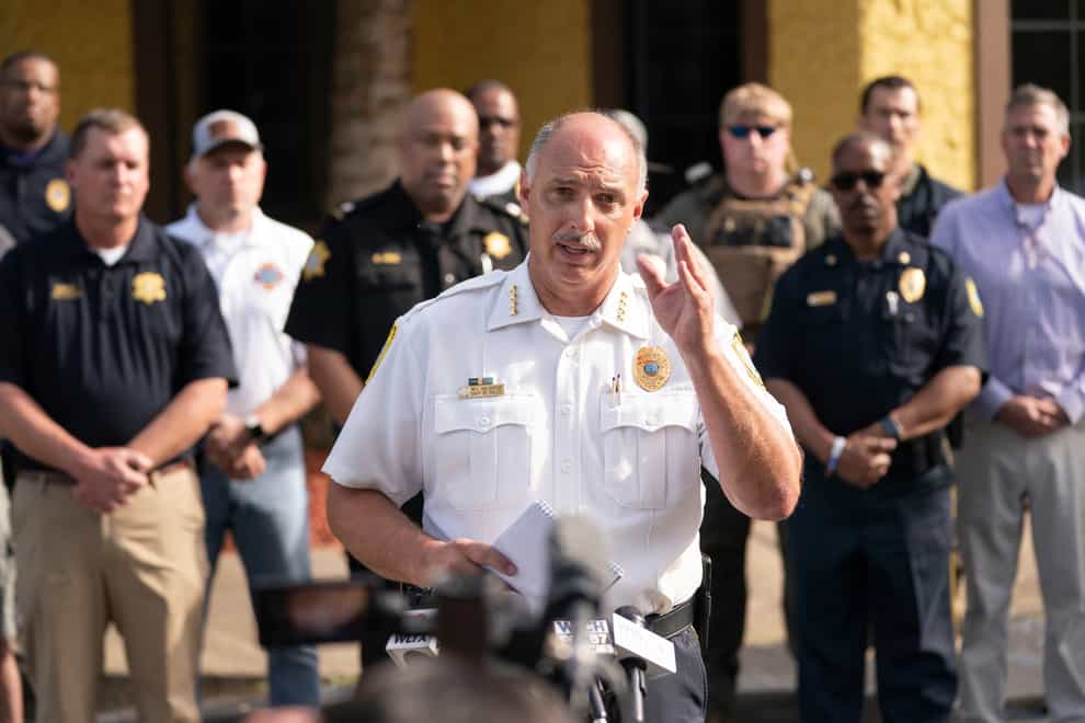 Police have arrested a 22-year-old man in connection with a shooting at a busy shopping mall in South Carolina’s capital on Saturday that left 14 people injured (Sean Rayford/AP)