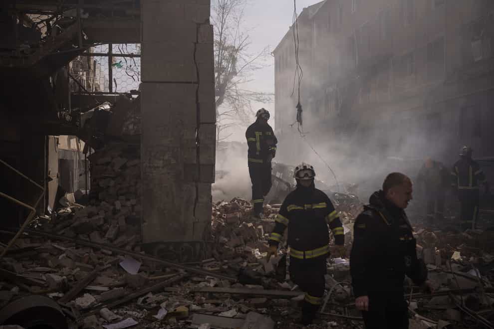 Firefighters work to extinguish multiple fires after a Russian attack in Kharkiv, Ukraine (Felipe Dana/AP)