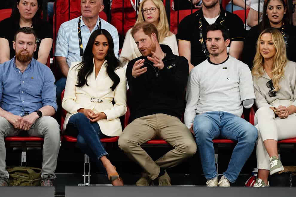 The Duke and Duchess of Sussex sit in the crowd at the Invictus Games (Aaron Chown/PA)