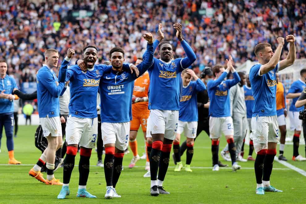 Rangers players celebrate a dramatic win (Steve Welsh/PA)