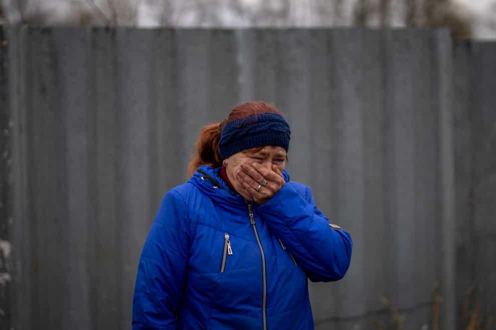 Ira Slepchenko, 54, mourns the death of her husband Sasha Nedolezhko (Emilio Morenatti/AP)