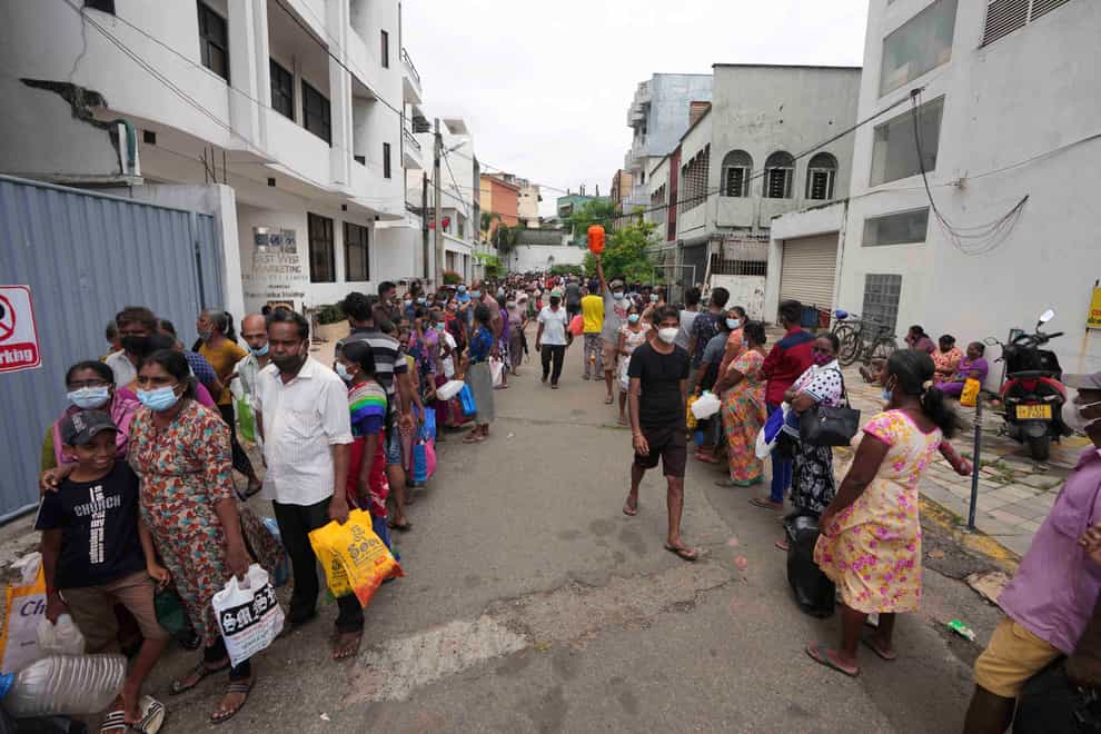Sri Lankans queue up to buy fuel (Eranga Jayawardena/AP)