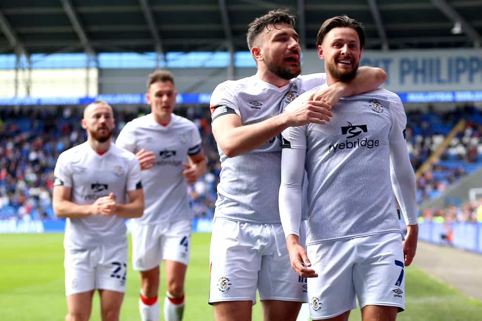 Harry Cornick, right, celebrates with team-mate Robert Snodgrass after scoring Luton’s winner at Cardiff (Nigel French/PA)