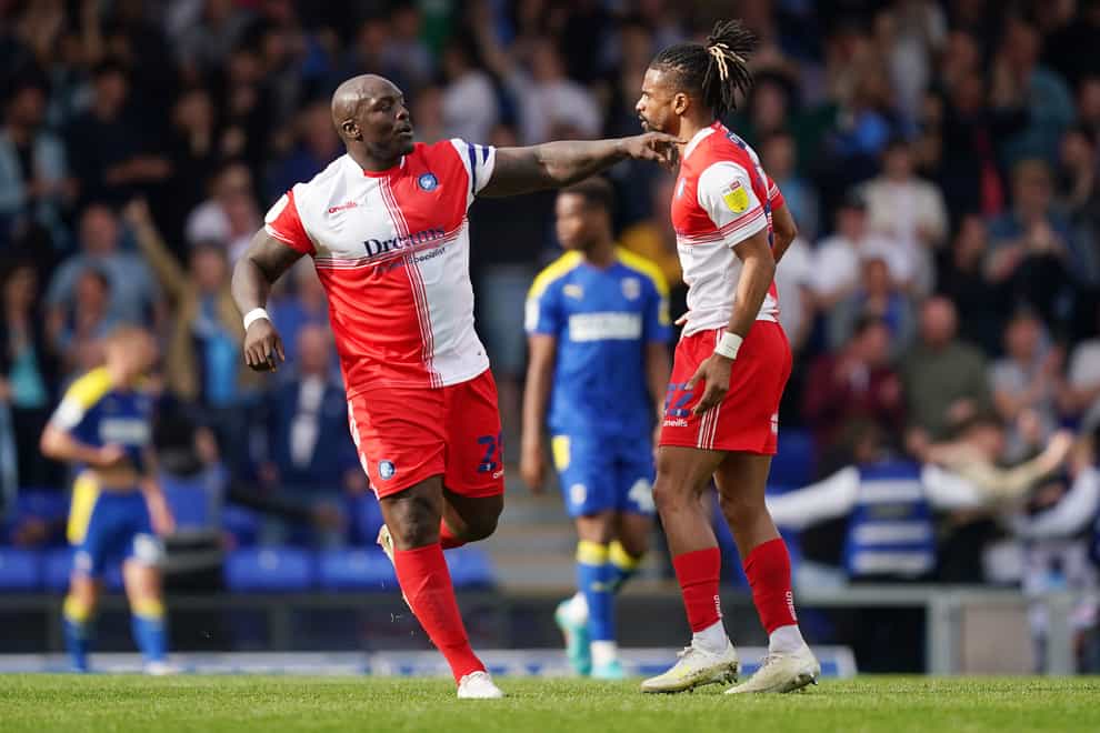 Wycombe substitute Adebayo Akinfenwa (left) celebrates after scoring an equaliser in the 1-1 draw at Wimbledon (Yui Mok/PA Images).