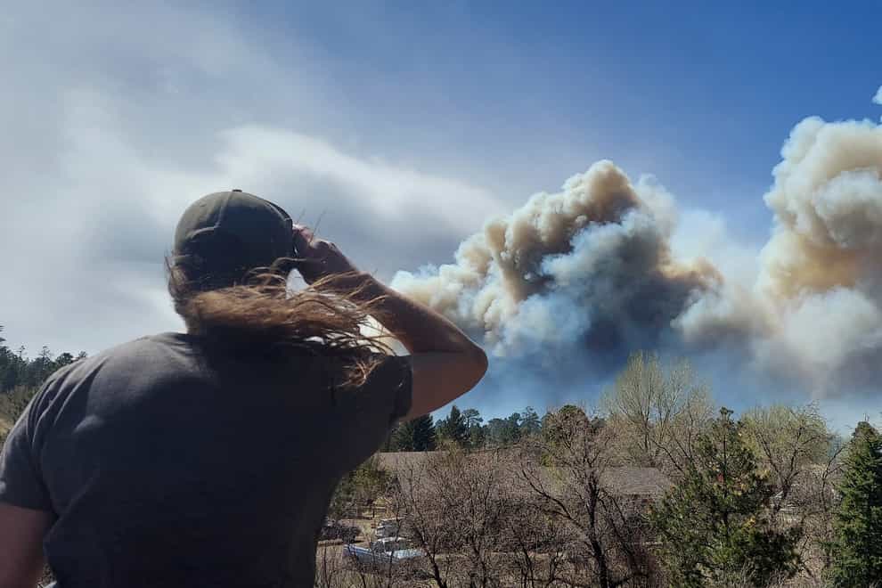 More than 700 homes have been evacuated due to a wildfire which kicked up a towering wall of flames outside a northern Arizona tourist town (Sean Golightly/AP)