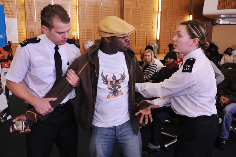 Police recruits enact a stop and search role play at a workshop in Wood Green, London (PA)