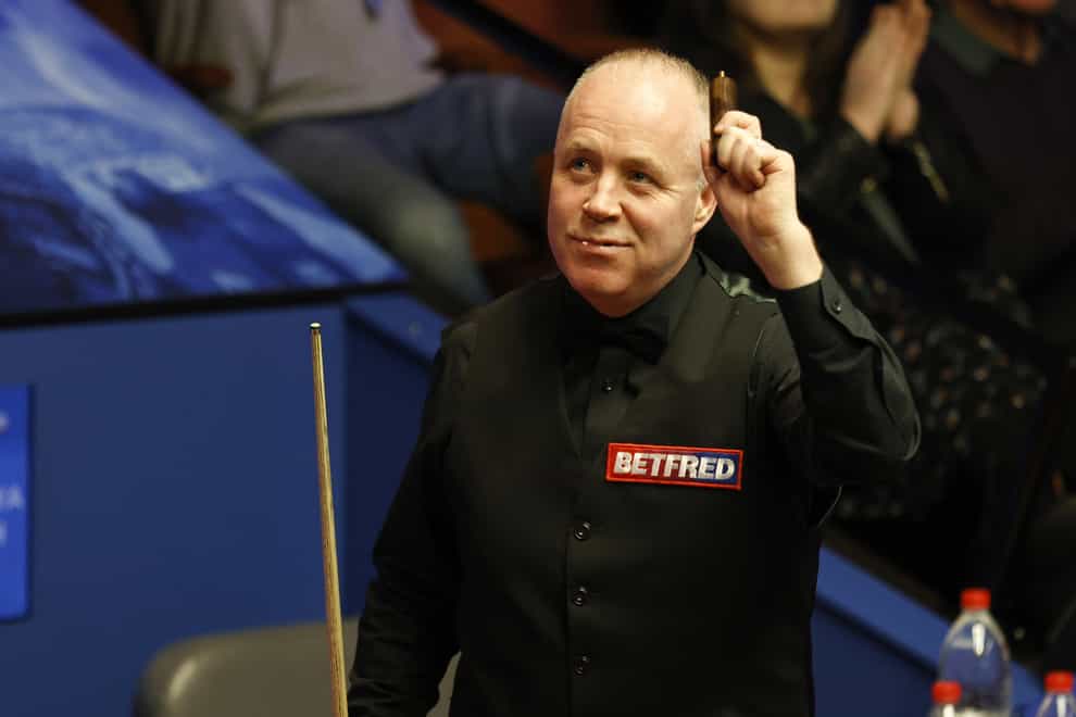 John Higgins saw off Thepchaiya Un-Nooh to reach the last 16 at the Crucible (Richard Sellers/PA)