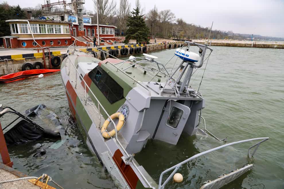 A damaged boat of the Ukrainian coastguard of the Sea of Azov is seen after heavy fighting in an area controlled by Russian-backed separatist forces in Mariupol, Ukraine (Alexei Alexandrov/AP)
