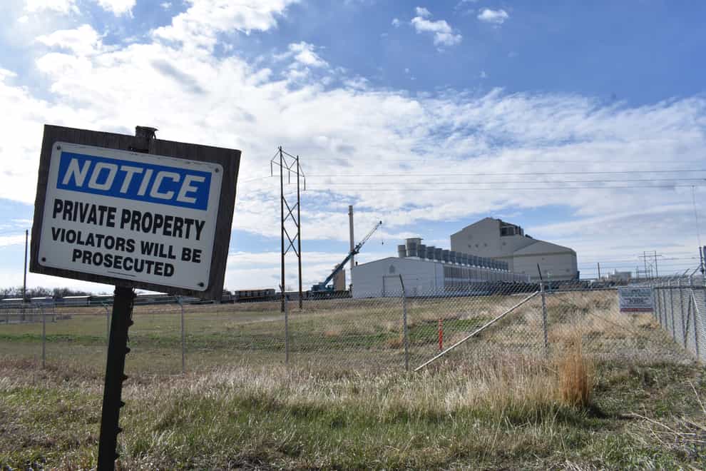 A no trespassing sign is seen near a coal-fired power station that also houses a cryptocurrency “mining” operation (Matthew Brown/AP)