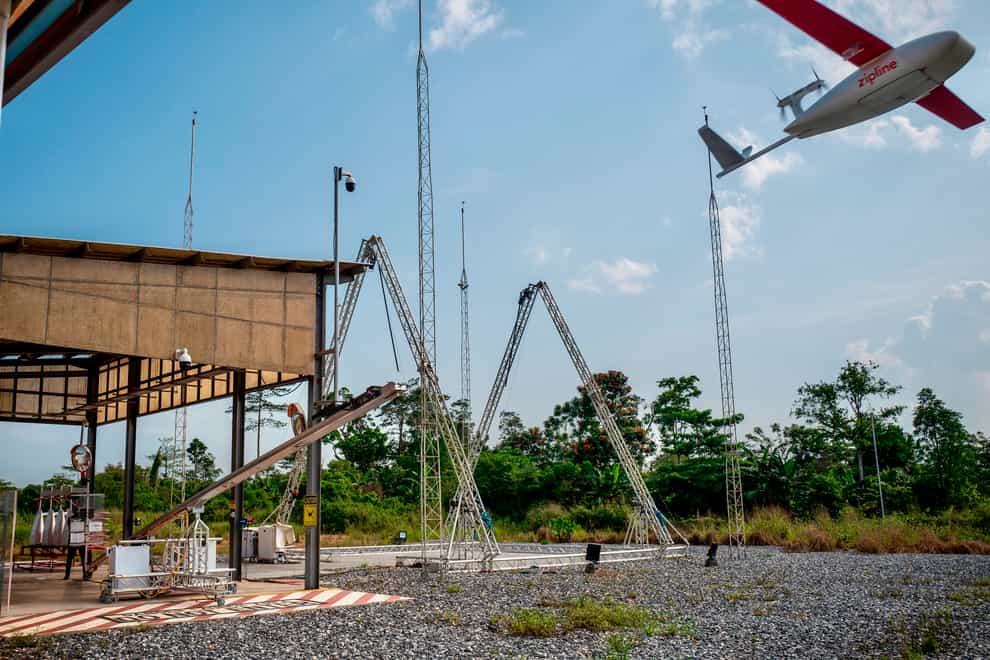A drone flies to make a delivery at a Zipline hub in Vobsi, Ghana in 2021 (Zipline/AP)
