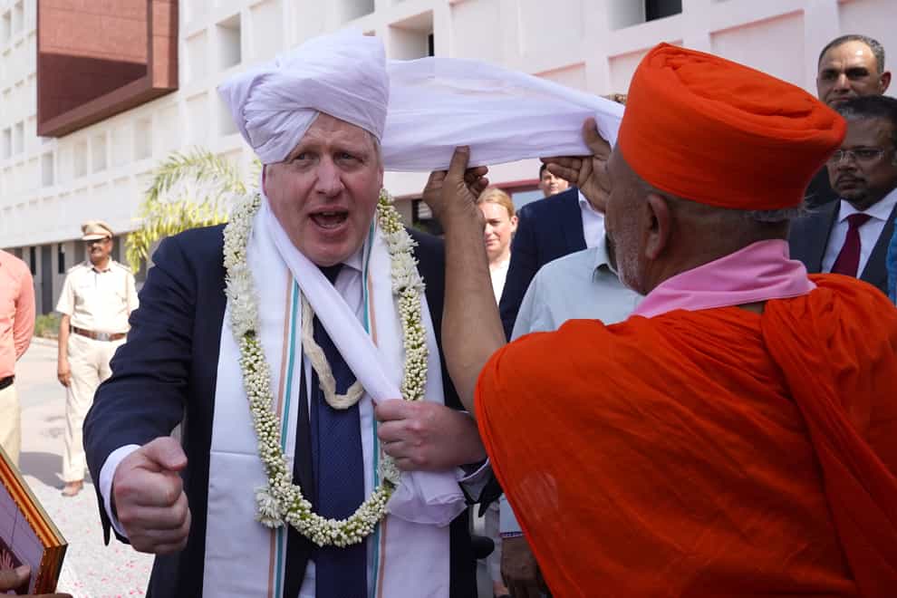 Prime Minister Boris Johnson wearing a turban at Gujarat bio technology University (Stefan Rousseau/PA)