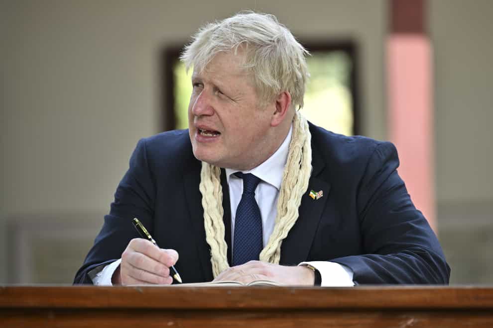 Prime Minister Boris Johnson writes in the visitors’ book during his visit to Mahatma Gandhi’s Sabarmati Ashram in Ahmedabad, as part of his two day trip to India. Picture date: Thursday April 21, 2022.