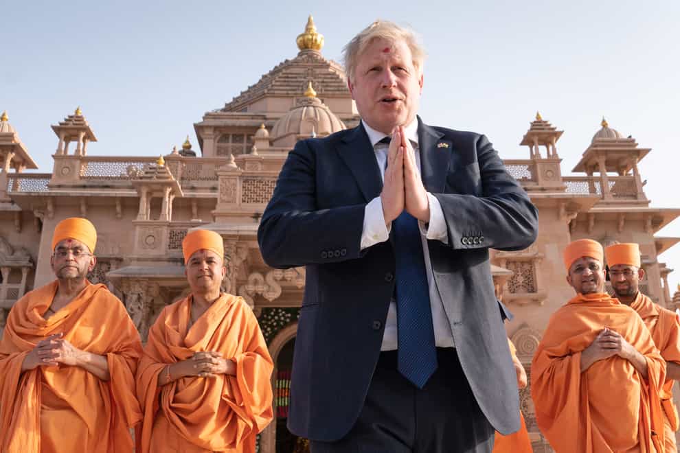 Boris Johnson is in India for a two-day visit, but there has been no escape from the partygate saga (PA)