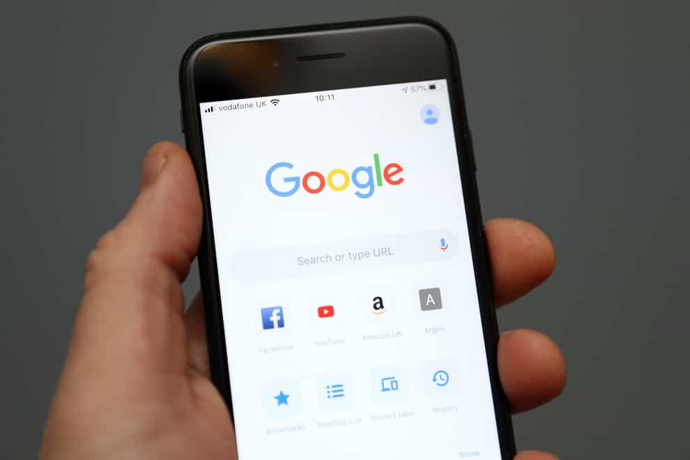 A person holds an iPhone showing the app for Google chrome search engine. Picture date: Friday January 3, 2020 (Andrew Matthews/PA)