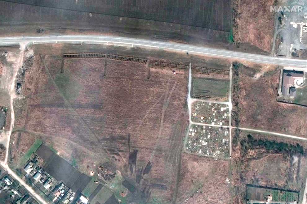 An overview of the cemetery in Manhush, west of Mariupol, Ukraine (Maxar Technologies via AP)