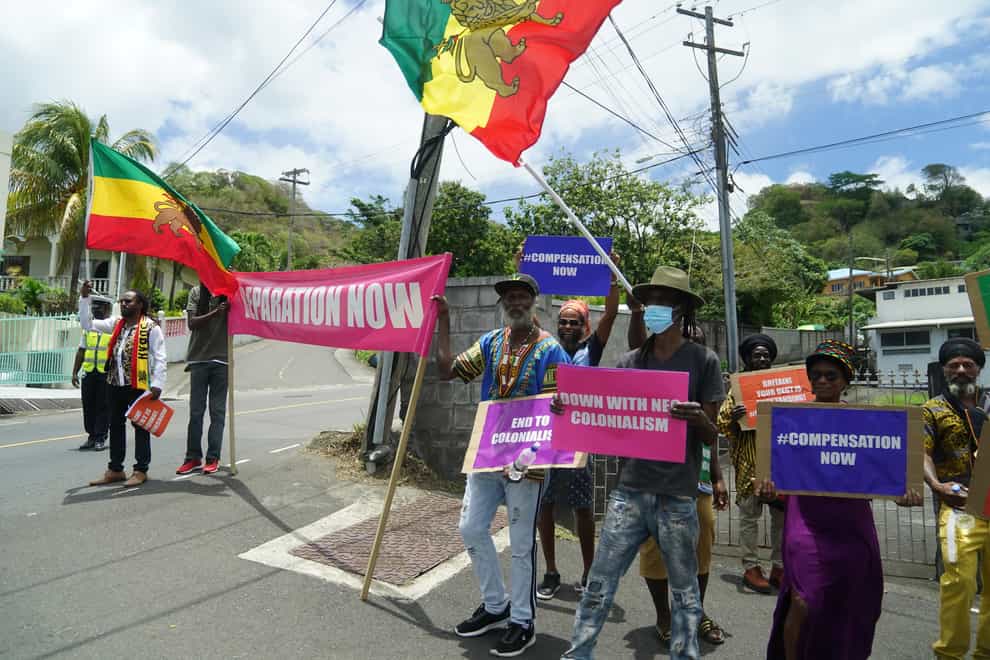 Protesters with with banners protesting against British colonialism as the Earl and the Countess of Wessex arrive at Government House in St Vincent and the Grenadines, as they continue their visit to the Caribbean, to mark the Queen’s Platinum Jubilee. Picture date: Saturday April 23, 2022.