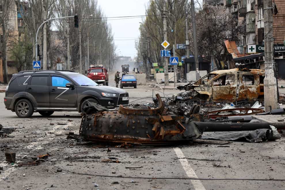 The turret of a destroyed tank lies in the street in Mariupol (AP Photo/Alexei Alexandrov)