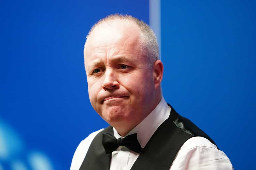 John Higgins, pictured, eased to victory over Noppon Saengkham (Zac Goodwin/PA)