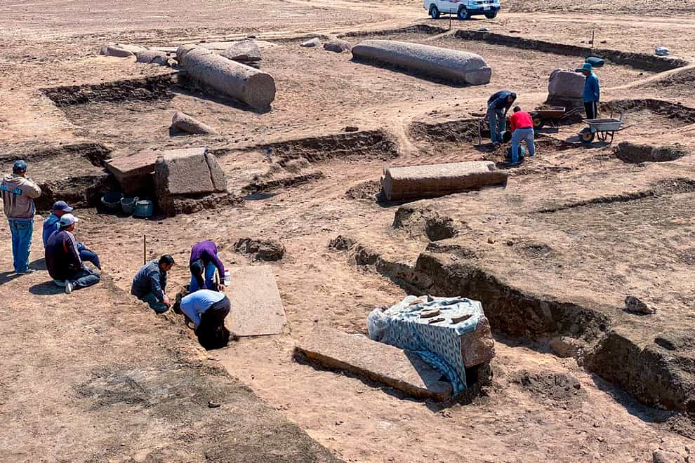 Archaeologists working in the ruins of the temple (Egyptian Tourism and Antiquities Ministry via AP)
