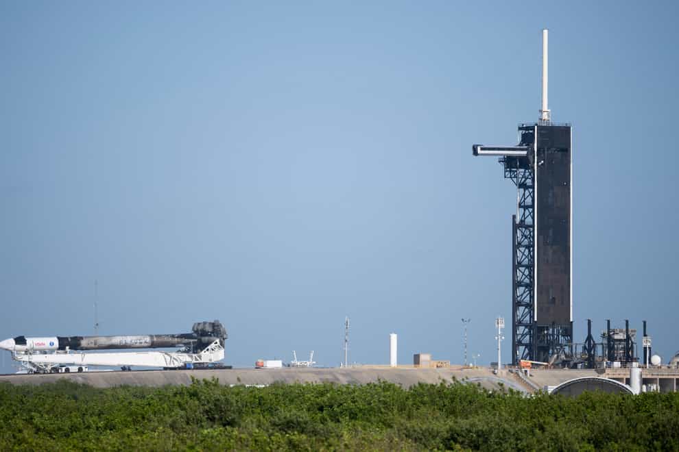 A SpaceX Falcon 9 rocket with the company’s Crew Dragon spacecraft (Joel Kowsky/AP)