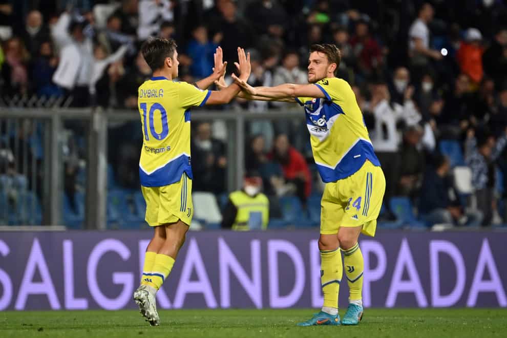 Paulo Dybala, left, drew Juventus level before they went on to win at Sassuolo (Massimo Paolone/AP)