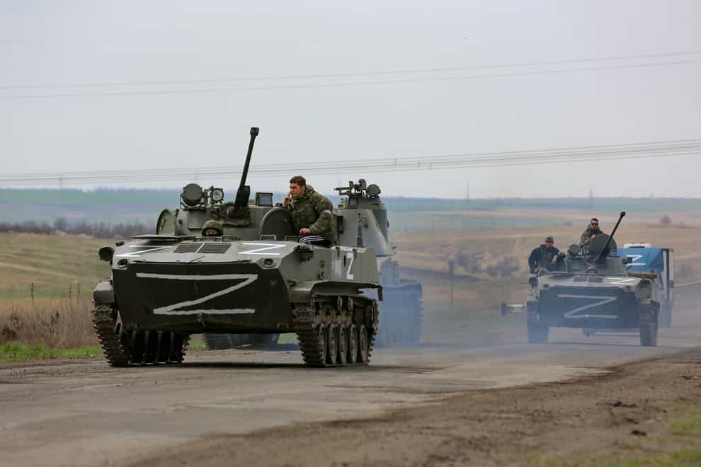 Russian military vehicles move on a highway in an area controlled by Russian-backed separatist forces near Mariupol, Ukraine (Alexei Alexandrov/AP/PA)