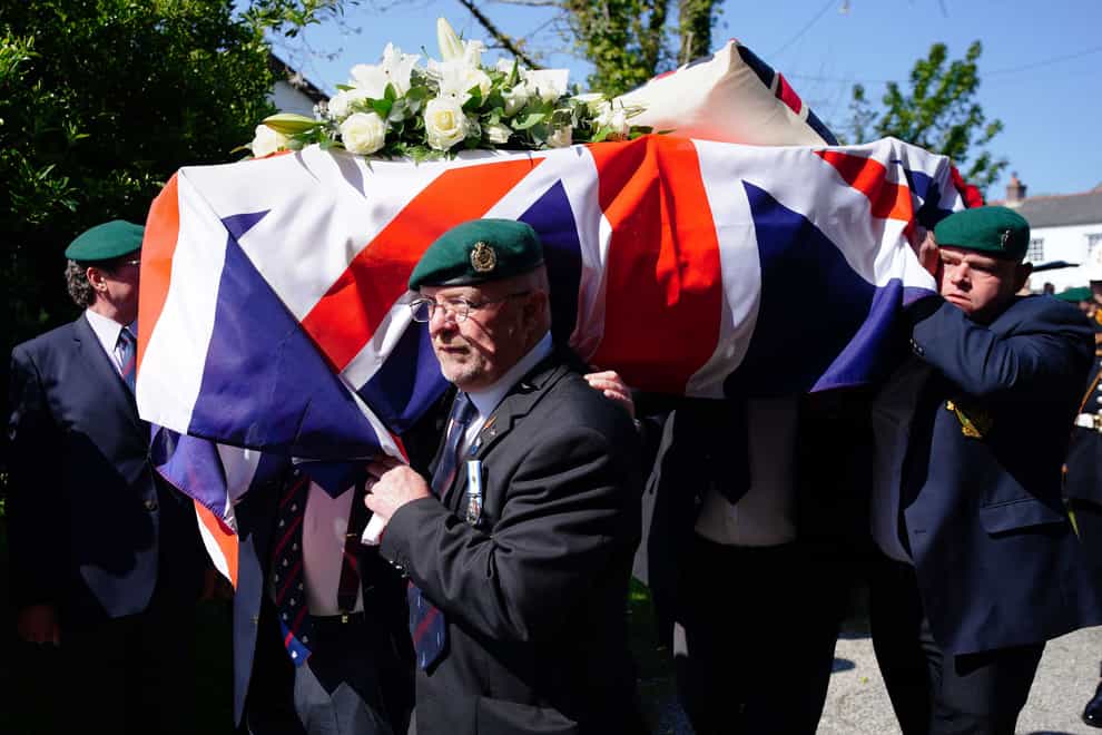 The coffin of 96-year-old Harry Billinge is carried into St Paul’s Church in Charlestown, Cornwall (Ben Birchall/PA)