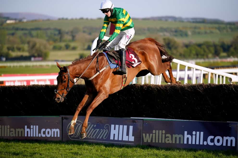 Capodanno and Mark Walsh clear the final fence at Punchestown (Niall Carson/PA)
