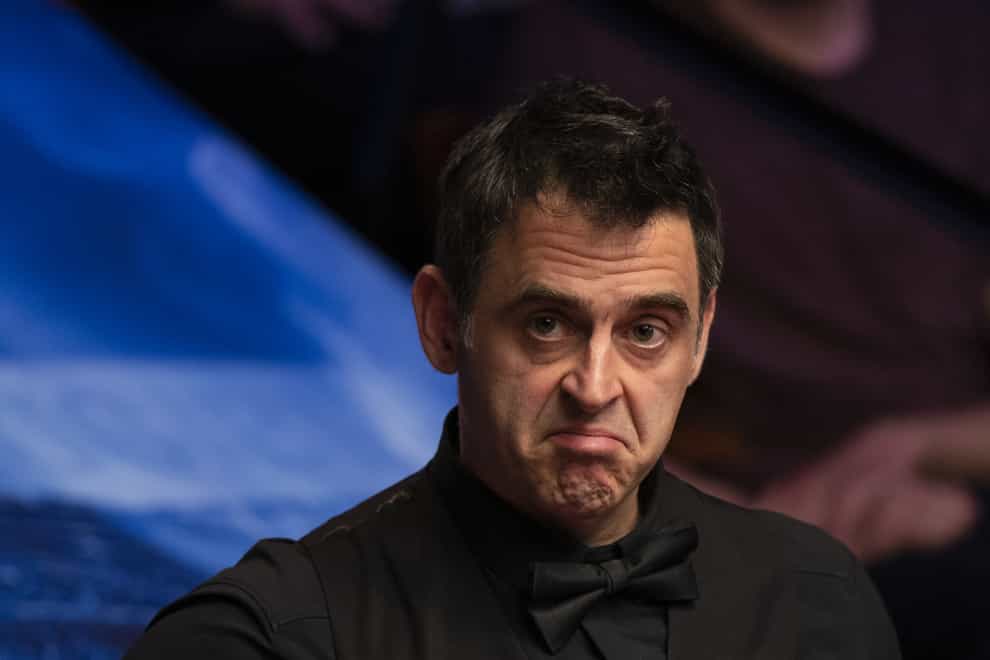 Ronnie O’Sullivan made a century as he eased past Stephen Maguire (Martin Rickett/PA)