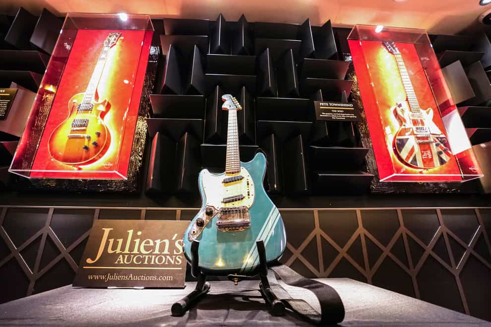 Kurt Cobain’s 1969 Fender Mustang Competition Lake Placid Blue Finish electric guitar, which he used in the video for Nirvana’s Smells Like Teen Spirit, on display at the Hard Rock Cafe, London, before it goes up for auction, with an estimate of 600,000 – 800, 000 US dollars in the Julien’s Auctions Music Icons three-day auction event in New York, beginning on May 20. Picture date: Wednesday April 27, 2022.