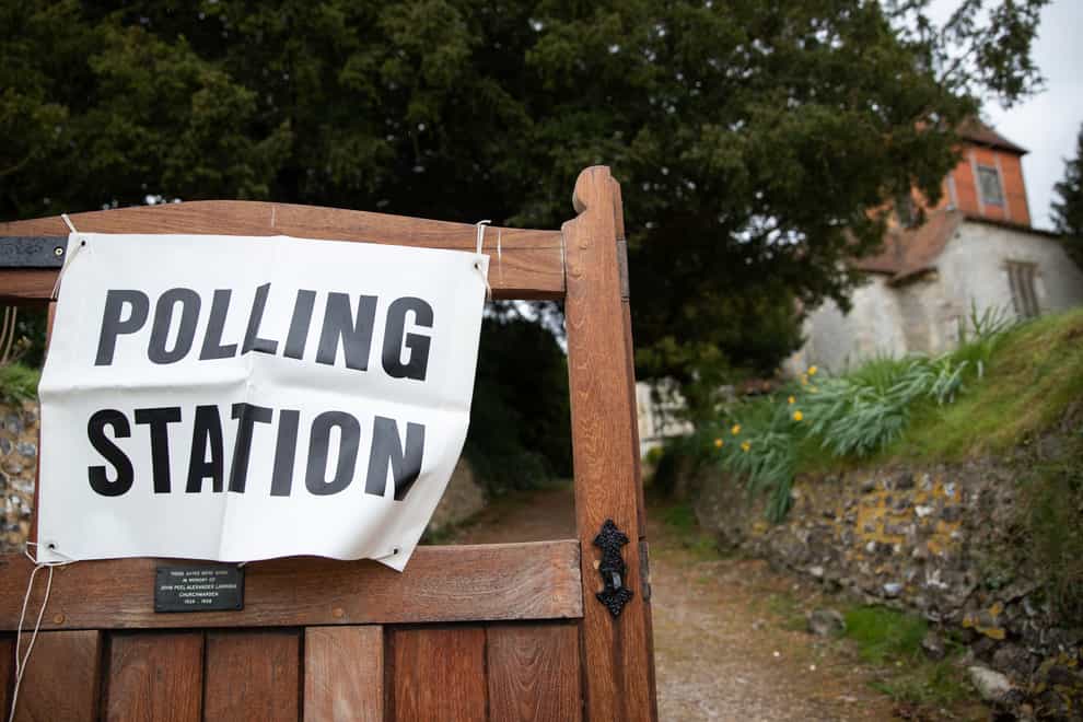 A polling station sign outside All Saints Church in Monk Sherborne, Hampshire (Andrew Matthews/PA)