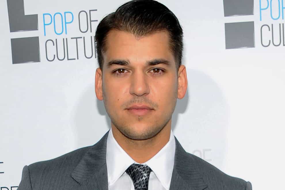 Rob Kardashian has testified that he feared for his life on a night in 2016 when his then-fiancee Blac Chyna pointed a gun at his head, pulled a phone-charging cable around his neck and repeatedly hit him with a metal rod while under the influence of substances (AP Photo/Evan Agostini, File)